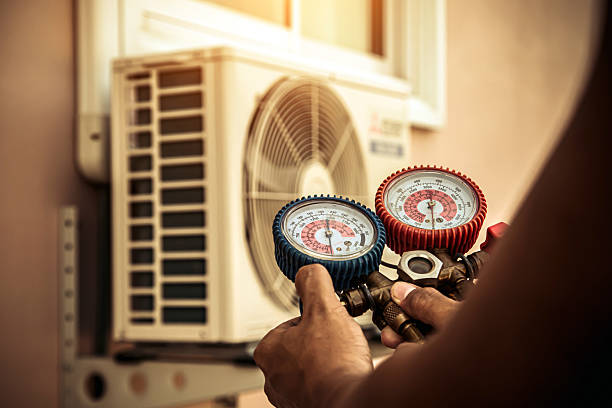 Professional Heat Pump Repair technician working in Red Rock, TX
